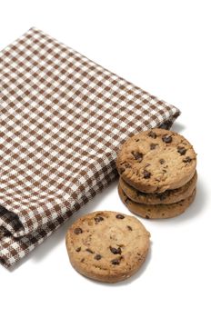 chocolate chip cookies with kitchen towel on a white background