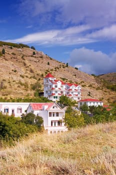 House with red roof on the hills