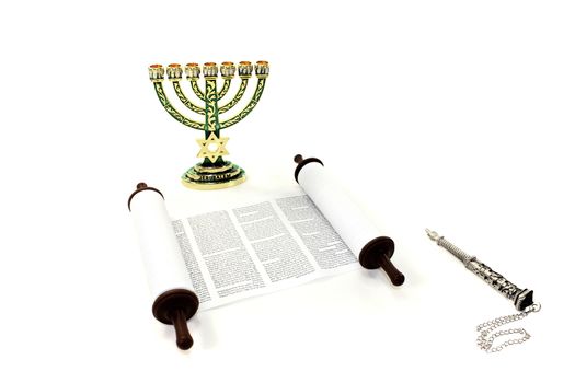 Torah scroll with menorah and pointer on light background