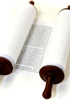 white Torah scroll on a light background