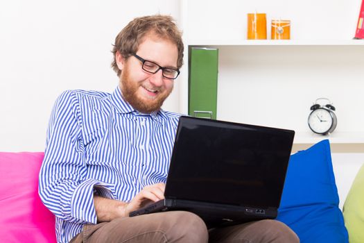 Man chatting by computer with another person