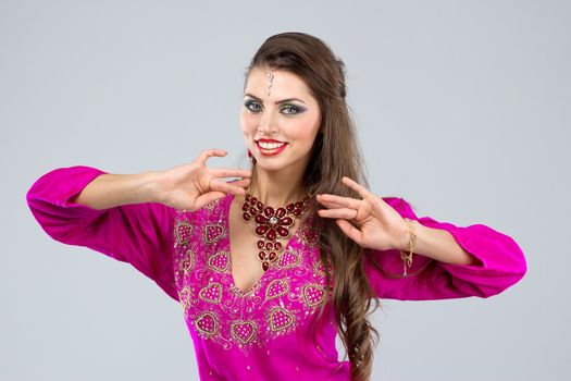 Pretty European woman posing in Indian Style