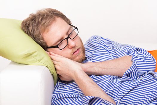 Young man sleeping on the couch