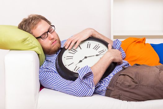 Young man sleeping on the couch  - studio shoot 