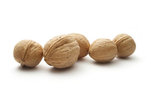 Heap of walnuts on white