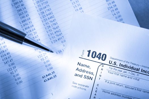 Tax form, operating budget and pen 