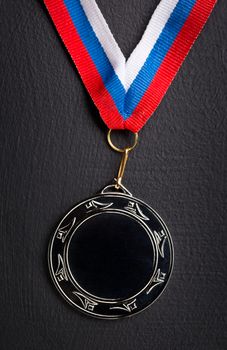 Metal medal with tricolor ribbon 