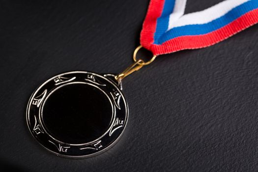 Metal medal with tricolor ribbon 