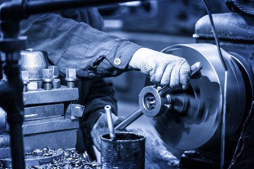 Turning lathe in the workshop in blue