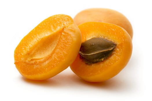 Ripe apricots on white background