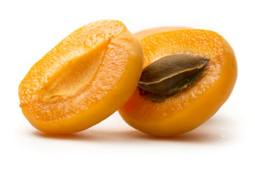 Ripe apricots on white background