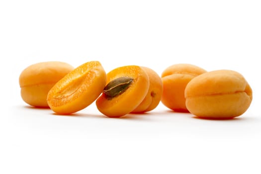 Ripe apricots on white background