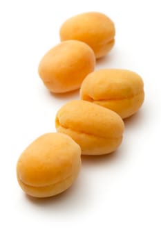 Ripe apricots on white background