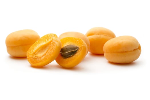 Ripe apricots on white background