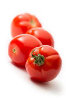 Fresh tomatoes on white 