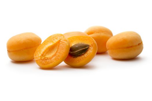 Ripe apricots on white background