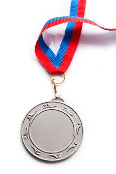 Metal medal with tricolor ribbon
