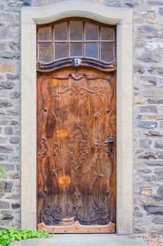 Antique heavy door made ​​of wood
