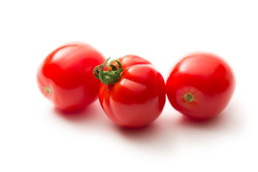 Fresh tomatoes on white