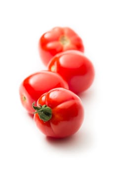 Fresh tomatoes on white