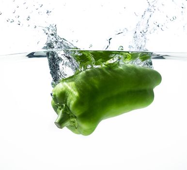 Fresh paprika in water splash