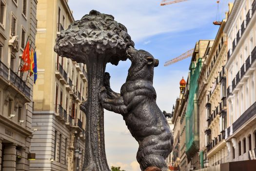 Bear and Mulberry Tree El Oso y El Madrono Statue Symbol of Madrid Puerta del Sol Gate of the Sun Most Famous Square Building Cranes in Madrid Spain Statue created in 1967 by sculptor Antonio Navarro Santa Fe