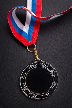 Metal medal with tricolor ribbon 