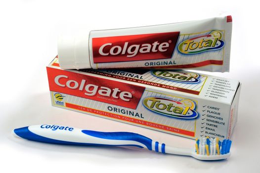 Set of Colgate toothpaste with toothbrush on white background