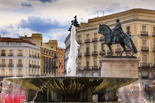 Puerta del Sol Gate of the Sun Most Famous Square Fountain King Carlos III Equestrian Statue in Madrid Spain King of Spain in the 1700s.  Replica of statue created in 1700s by Juan Pascal de de Mena