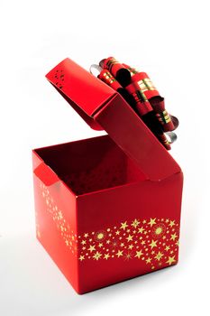 A red gift box with a red bow and gold