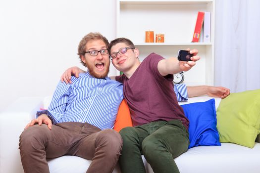 Two friends doing selfie at room - studio shoot 