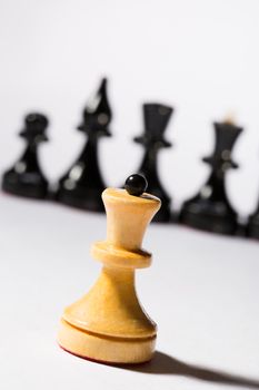 Black and white chessmen on white 