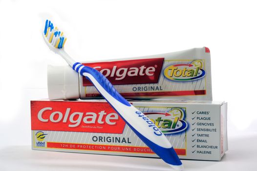 Set of Colgate toothpaste with toothbrush on white background