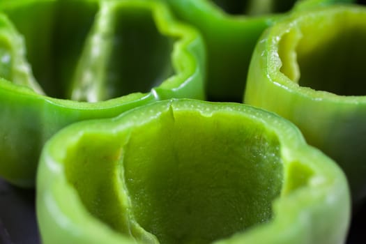 Green bell peppers cut and cleaned for stuffed peppers.