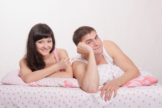 Young couple with a rest after work in bed