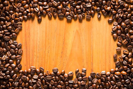 Coffee on teak wooden background