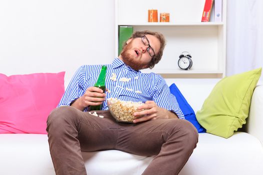 Sleeping at a party with popcorn and beer - studio shoot 