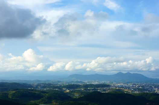 Wonderful Vietnam country landscape, view chain of mountain, beautiful cloudy sky, residence at green valley, fresh air, impression cloudscape, nice countryside for Dalat travel