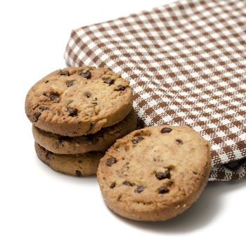 chocolate chip cookies with kitchen towel on a white background