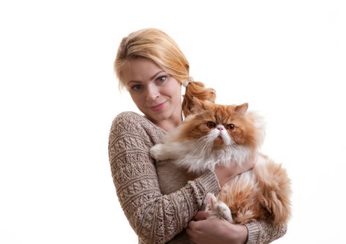 The young nice girl holds a red Persian cat on hands