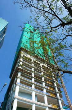 HO CHI MINH CITY, VIET NAM- OCT 10: Development of Asia city with construction highrise office building, project with modern architecture design, the building up into sky, Vietnam, Oct 10, 2014