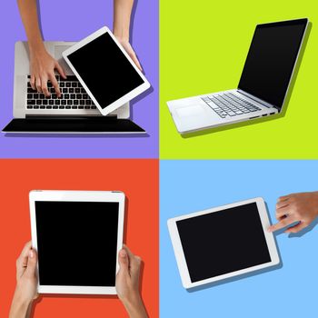 Human hand using laptop and holding tablet