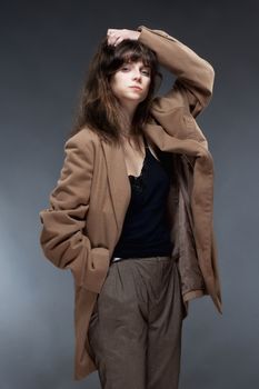 Portrait of a Young Woman in Brown Coat