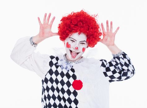 Little Girl in Red Wig, Makeup and Outfit Posing as a Clown.