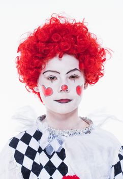 Little Girl in Red Wig, Makeup and Outfit Posing as a Clown.