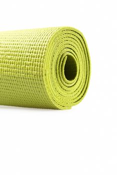 Green exercise mat isolated on white background. 