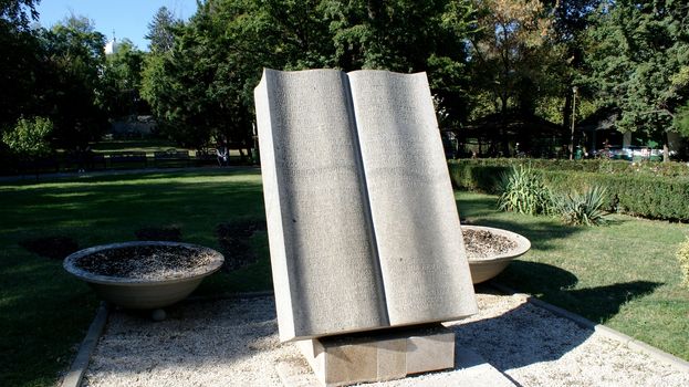 Book in park in Bucharest, sculpture, monument of stone