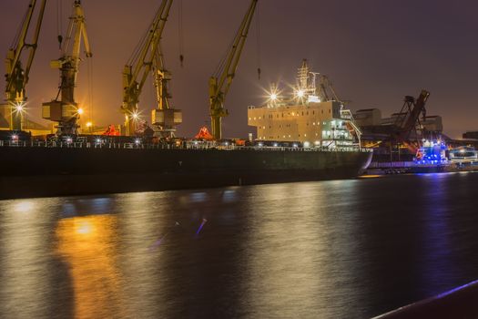 Cargo ship in the port of Ventspils, Latvia.at night