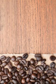 coffee beans on teak wooden table
