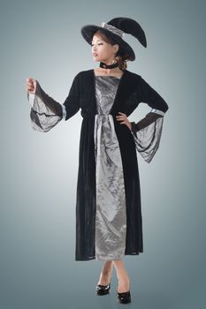 Asian witch hold something, full length portrait isolated.